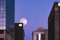 Large moon over downtown Grand Rapids.