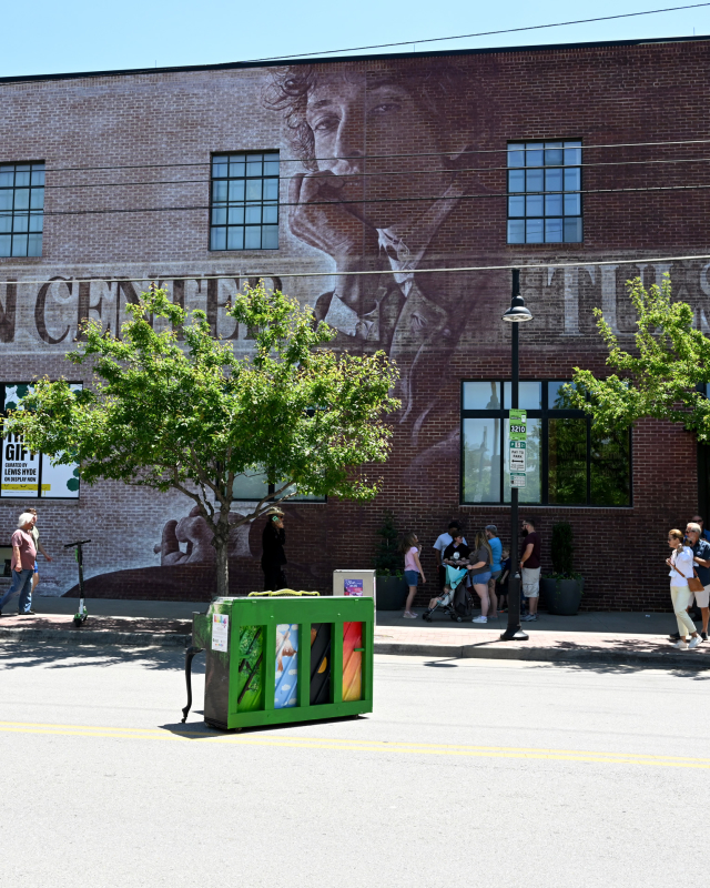 Bob Dylan Center exterior with people walking in front of it