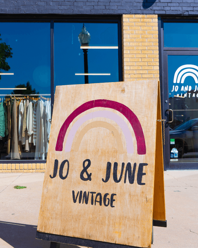 Wooden sign for Jo & June Vintage outside the Jo & June Vintage storefront