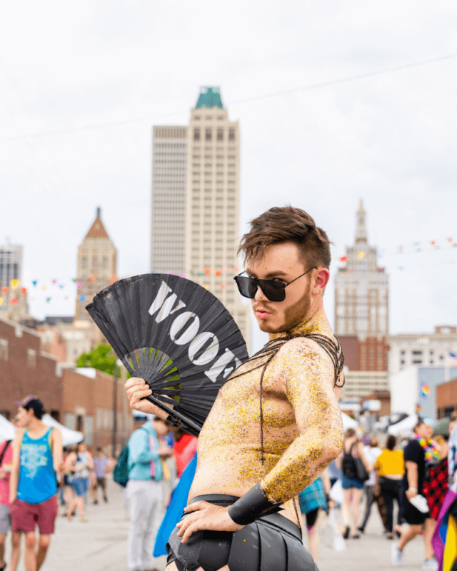 Someone posing during the Pride parade in downtown Tulsa