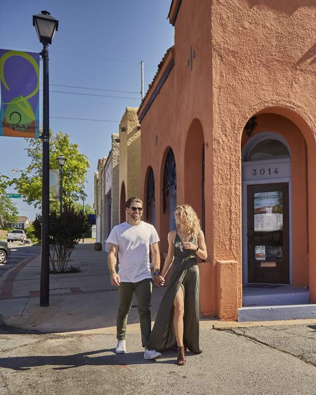 Couple walking through Oklahoma City's Paseo Arts District