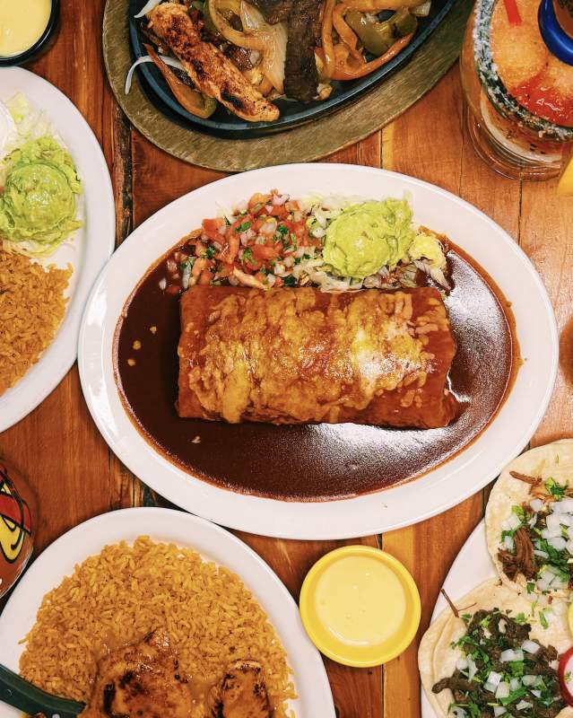 Table filled with food and drinks at Abel's Mexican Restaurant