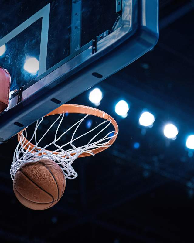 Basketball going into hoop