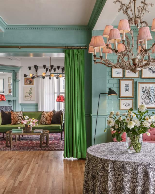A blue room with green and pink accents.