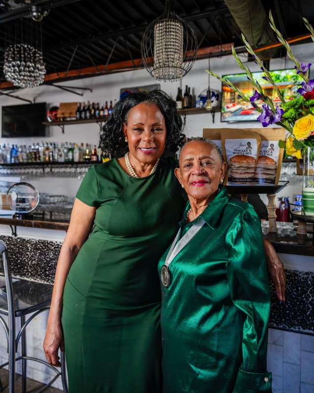 Florence Jones Kemp on the right, posing with her daughter, Victoria Kemp, at her restaurant, Florence's