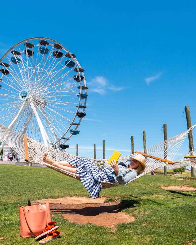 Woman reading in hammock at the Wheeler District Ferris Wheel