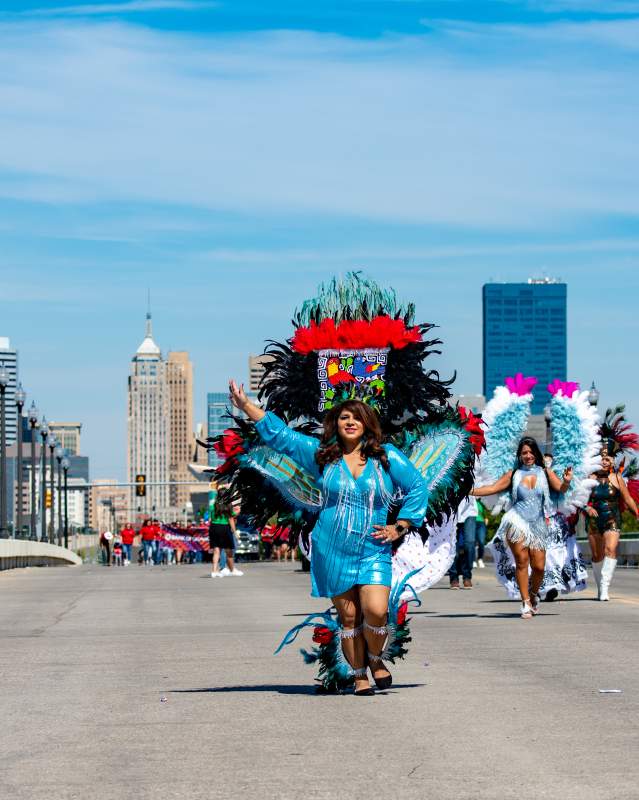 Woman walking in downtown OKC for the Fiestas de las Americas Parade