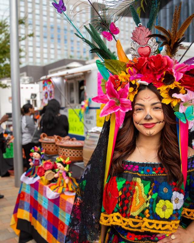 Woman dressed up for Dia de los Muertos Festival at Scissortail Park