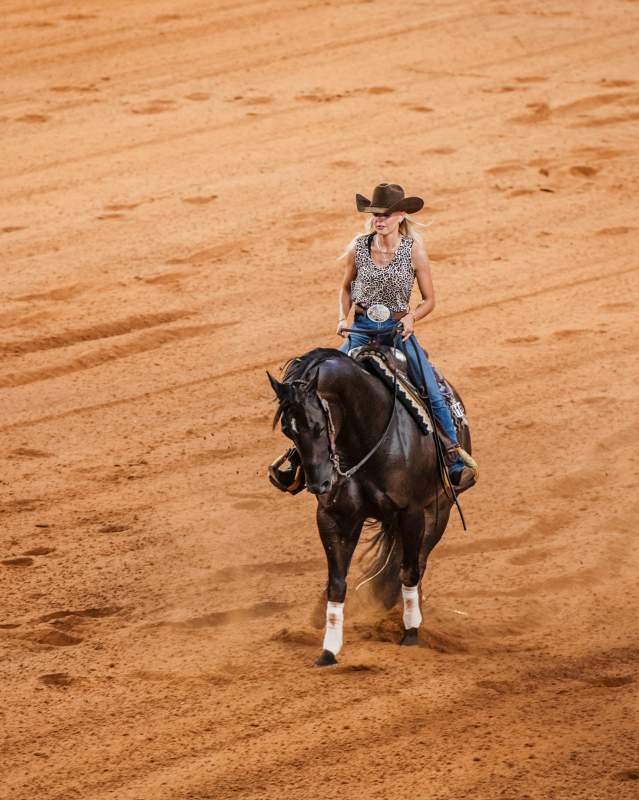 Woman riding horse at NRHA Derby at the OG&E Coliseum