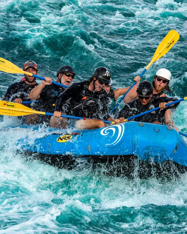 A group water rafts at Riversport