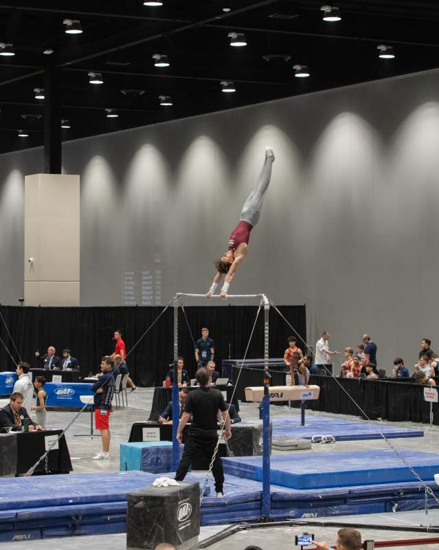Young boy doing gymnastics trick at the OKC Convention Center for the 2023 Youth Gymnastics Championships