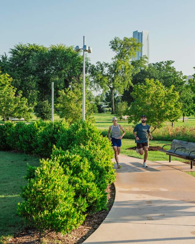 Couple runs in lower Scissortail Park