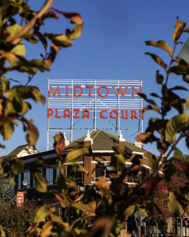 Midtown Plaza Court sign surrounded by fall leaves