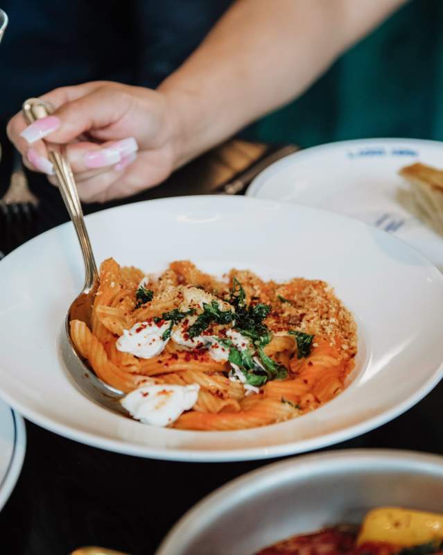 Table filled with food and drinks at Mary Eddy's Italian Grill