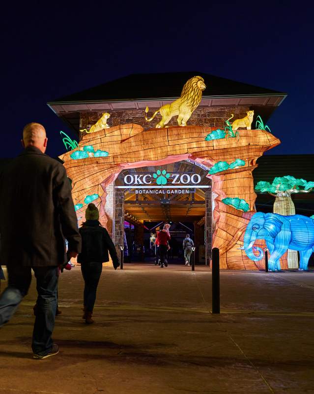 Family walking into the OKC Zoo's Safari Lights entrance