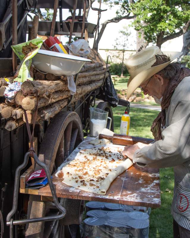 Man cooking at the Chuck Wagon Festival