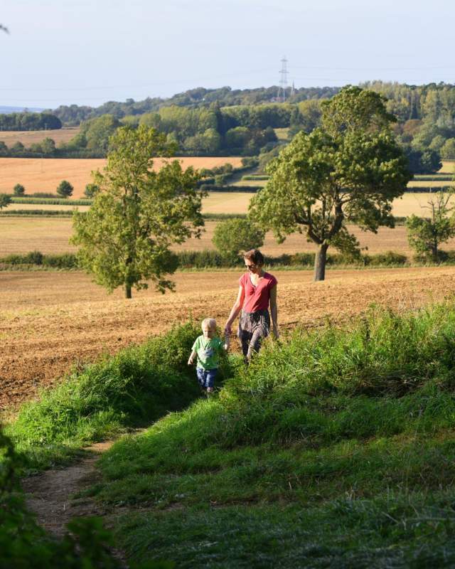 A mother and child walking along a path in the Lincolnshire Wolds, Viking Way.