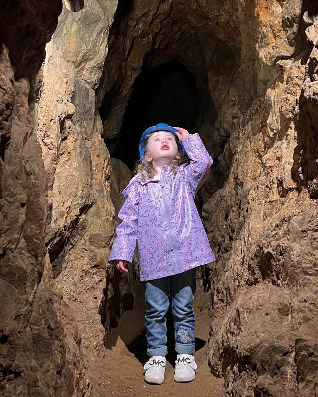 child looking up in the caves