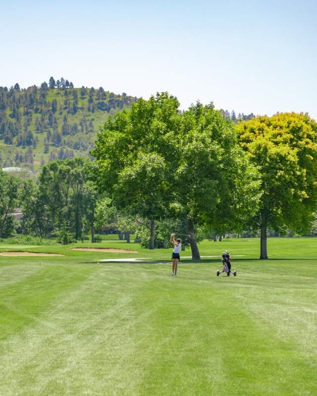 golfer enjoying the meadowbrook golf course in rapid city, sd