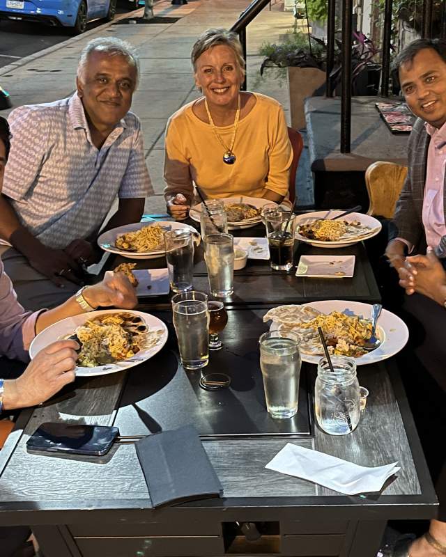 A group of people around an outdoor table at Chatty Monks, West Reading, PA