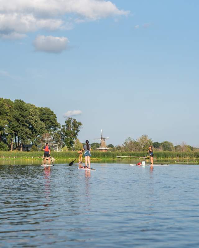 Paddle boarding on the Black River with DeZwaan Windmill on the horizon