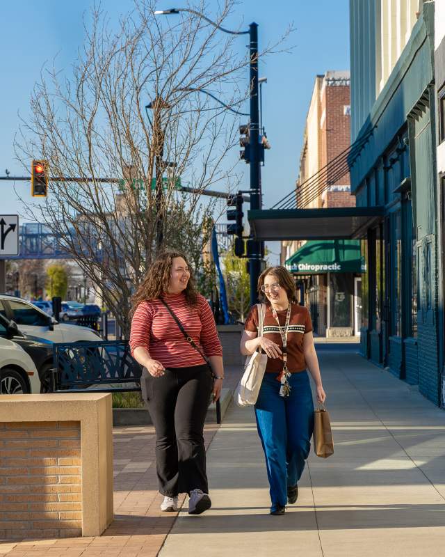 Two girls shopping down town on First Friday in Salina, Kansas