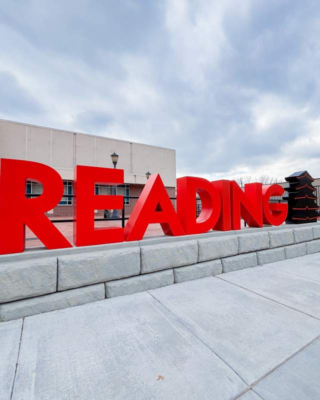 Red Reading sign with pagoda at the end. New art installation downtown