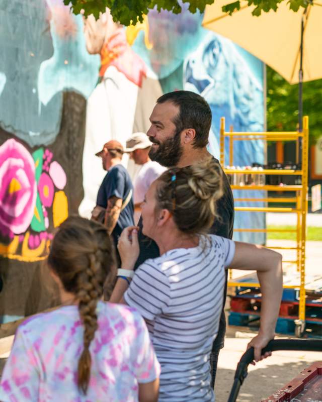 Family Watching Painters during Tulip City Walls Mural Fest