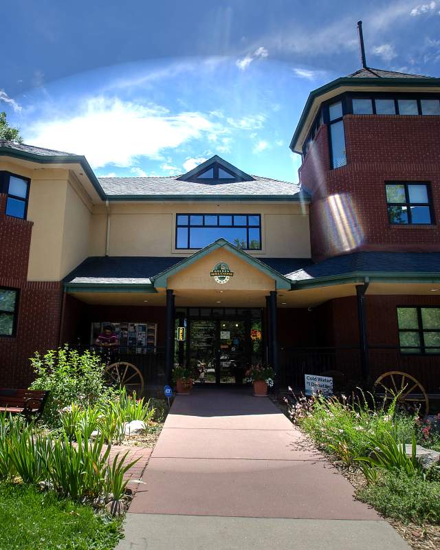 The front of the Golden Welcome Center two story building from Washington Ave.