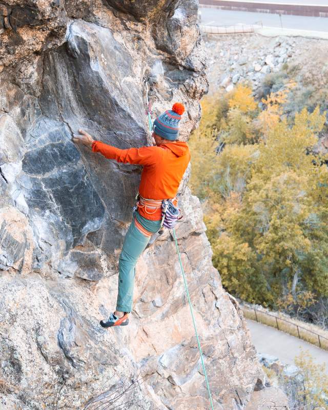 Climber ascending rock wall in Clear Creek Canyon