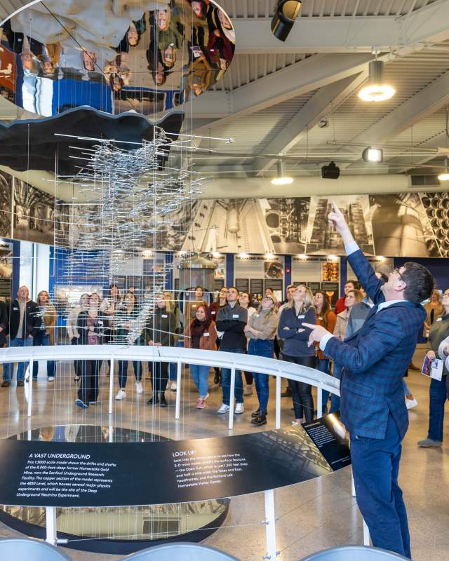 Visitors viewing an exhibit at the Sanford Lab Homestake Visitor Center