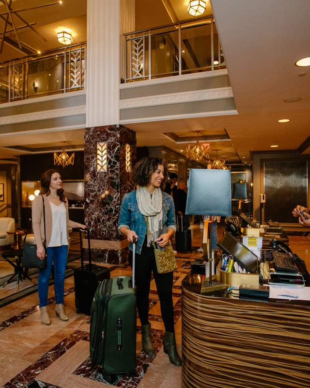 Woman checking in to Hotel LeVeque