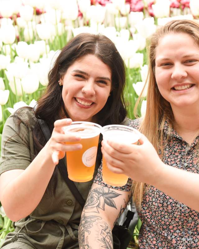 Two women enjoying drinks downtown Holland