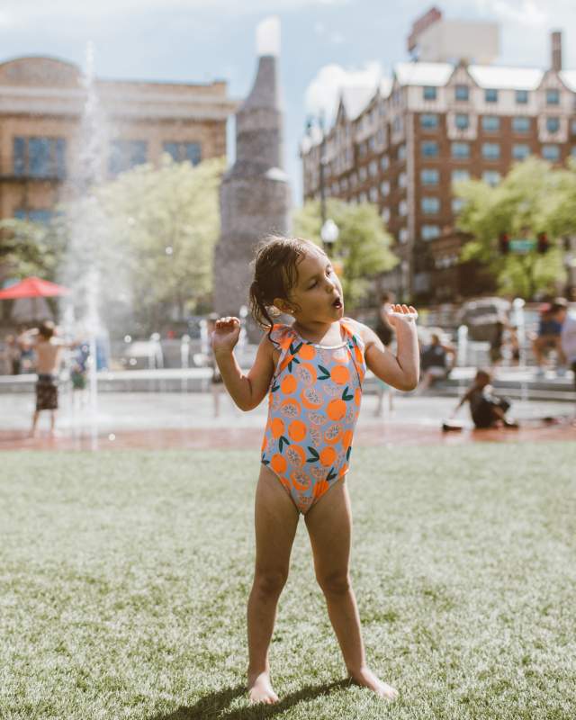 kids dancing at main street square in downtown rapid city, sd with fountains in the background