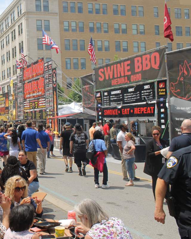 People walking downtown during the Rib White, & Blue Festival