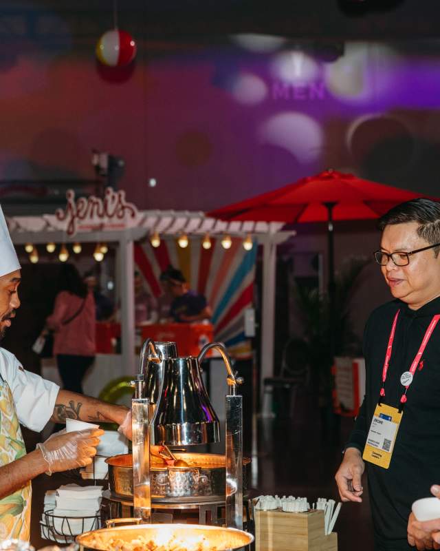 Chef serving guests during conference at Greater Columbus Convention Center