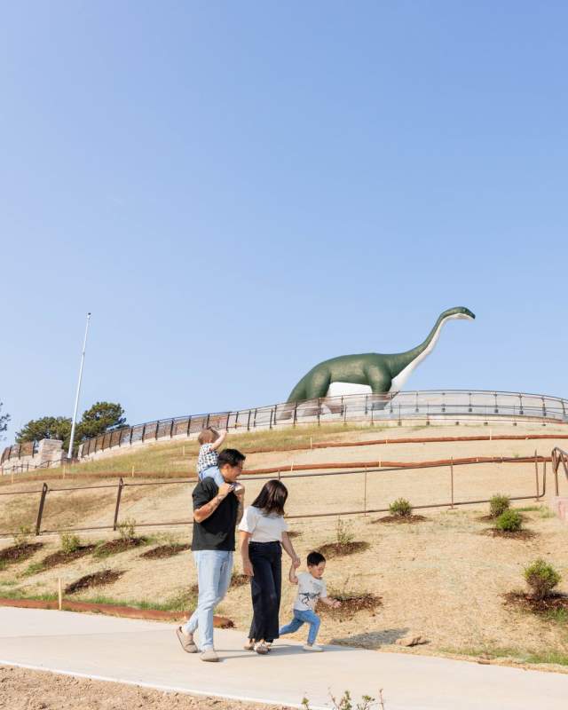 family walking the accessible trail now available at dinosaur park in rapid city, sd