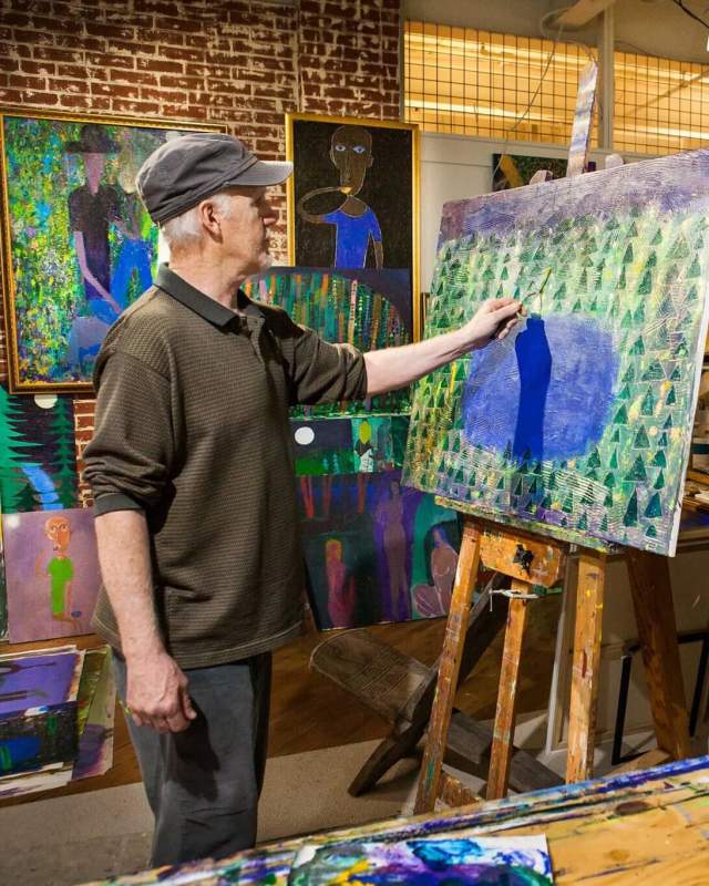 Artist painting at GoggleWorks Center for the Arts