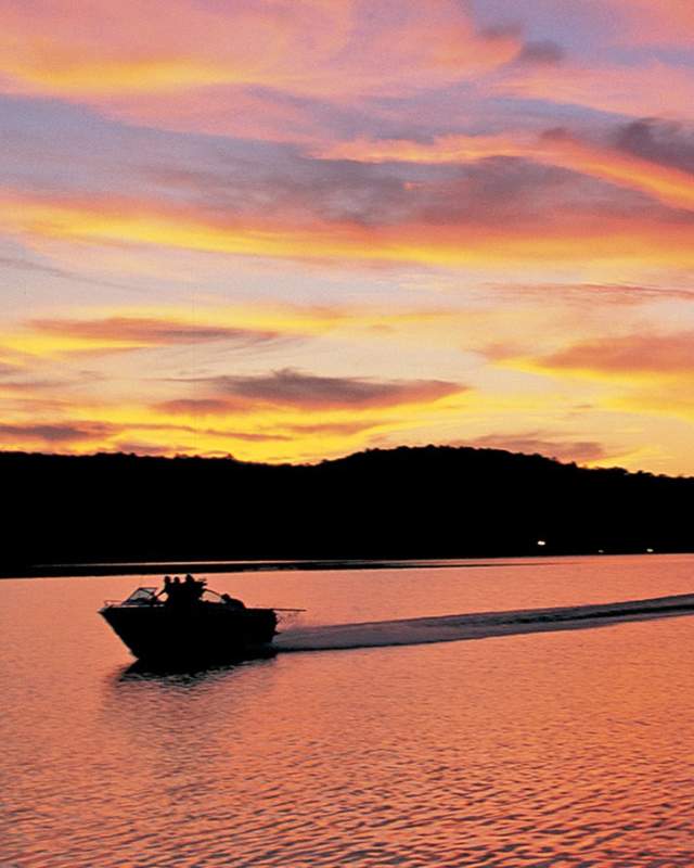 Grand Lake boater at sunset