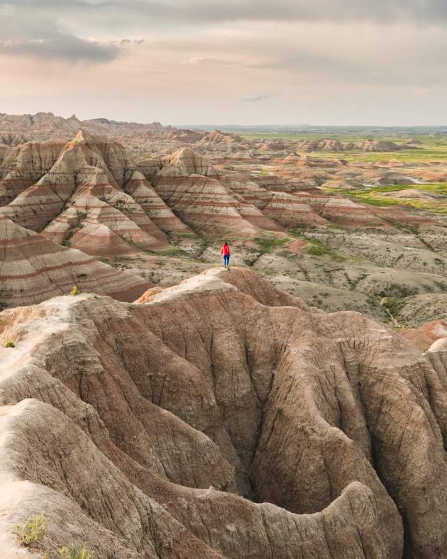 Woman walking on trail in Badlands National Park