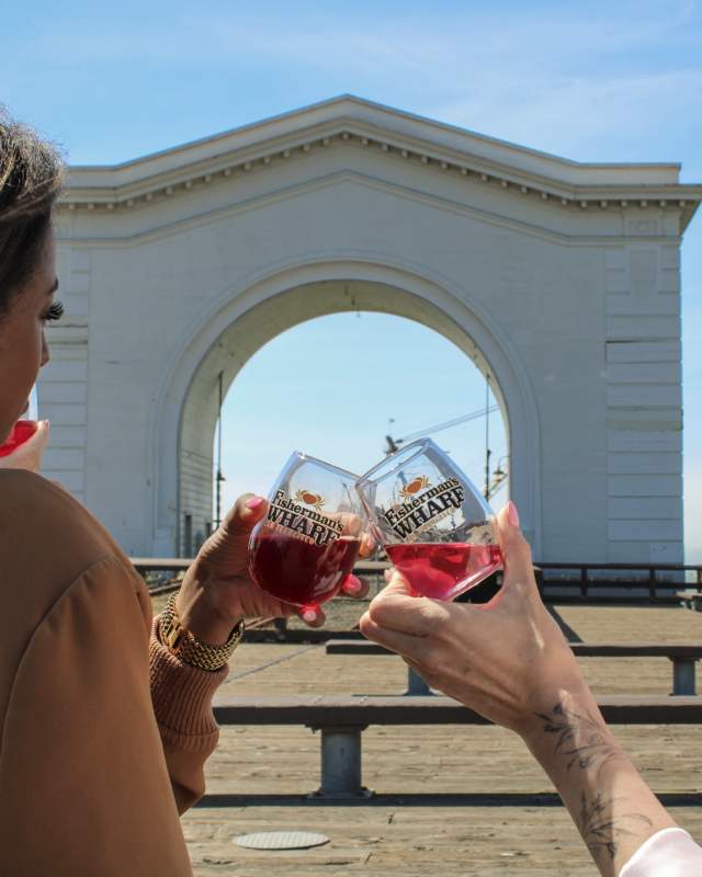 two wine glasses in front of Pier 43 San Francisco- Fisherman's Wharf Wine Walk