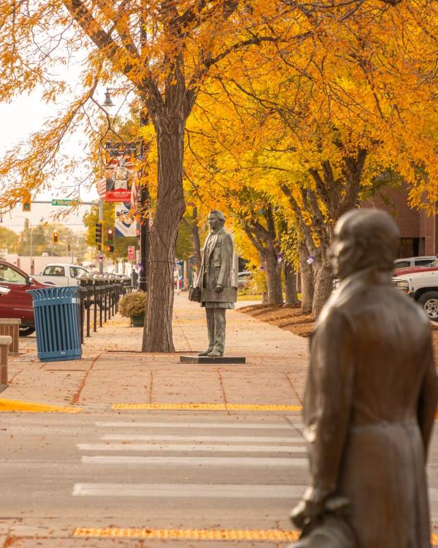 Fall colors with the city of president statues in downtown rapid city, sd