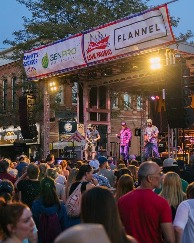 concert stage in the street in rapid city, sd with crowd  dancing to music
