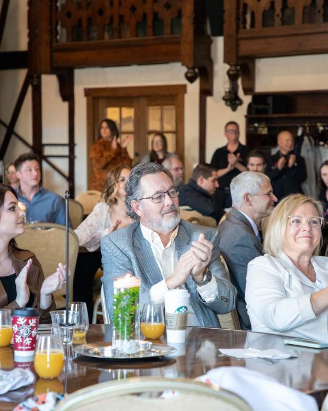 Group applauding at a businesses event in Rapid City, SD