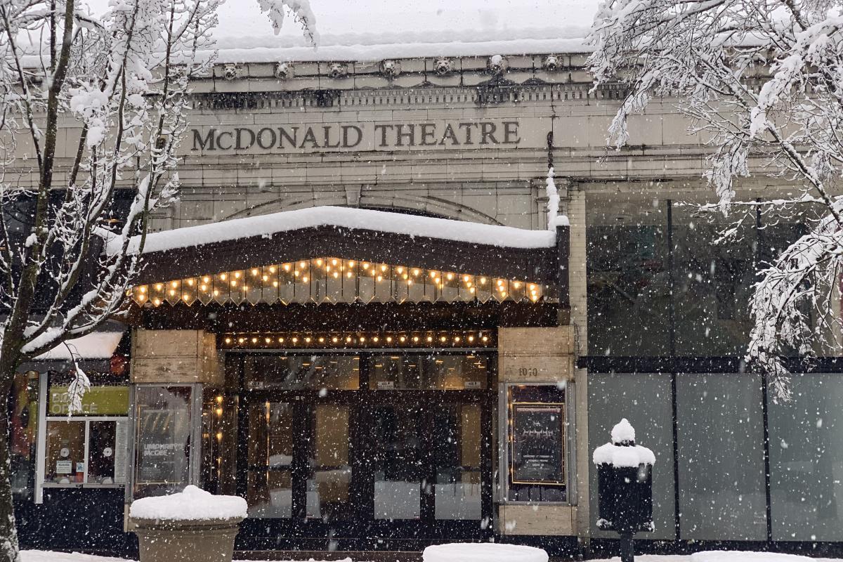 The front of McDonald Theatre in the snow.