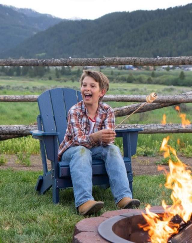 Family enjoying smores around a campfire