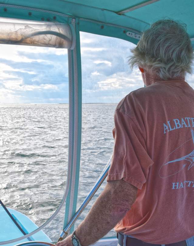 Captain Ernie Foster at the helm of an Albatross Fleet boat in the Outer Banks