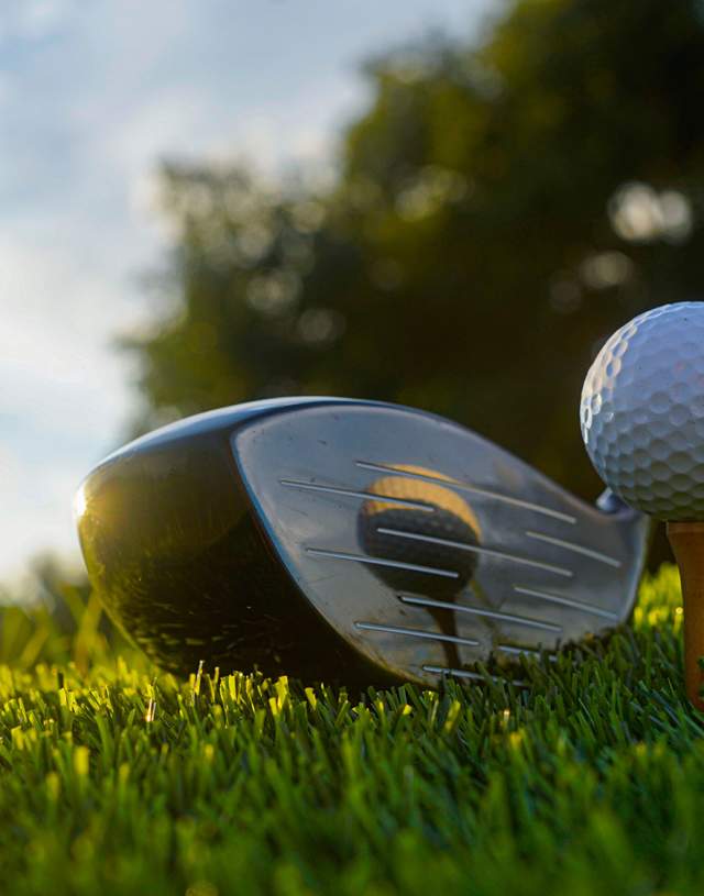 Golf ball and golf club on the golf course