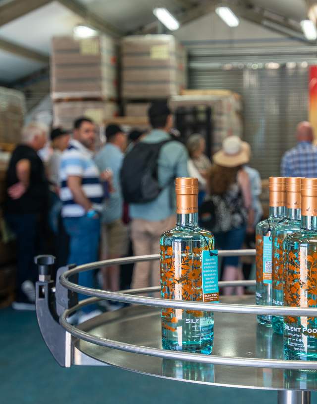 People on a distillery tour at Silent Pool Distillery