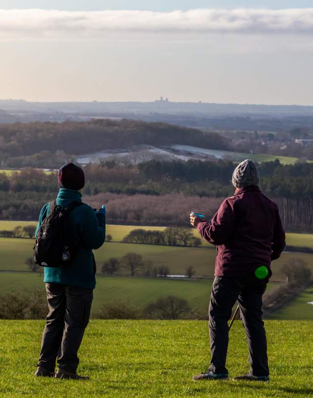 Two women overlooking a view of the Wolds